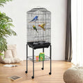 Black rounded-top bird cage on wheeled stand in a bright room
