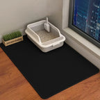 Black double-layer honeycomb cat litter mat shown beside a litter tray
